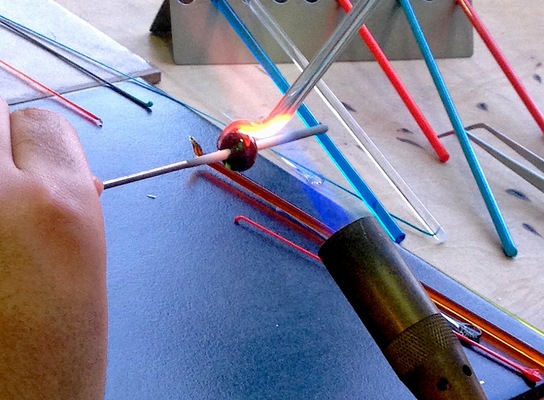 Carousel rainbow bead torch